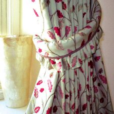 Red floral curtains with matching tiebacks