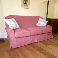 Pink sofa with complimentary cushions