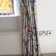 Floral curtains with metal tie back