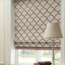 Pink and beige repeated patterned roman blinds