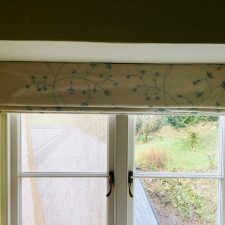 Simple blue and cream patterned roman blinds