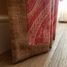 Hessian and red fabric curtains