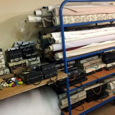 Pile of fabrics and fabric swatch books