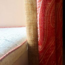 Red and hessian fabric curtains