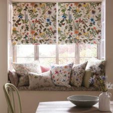 Summery botanical patterned curtains with matching cushions