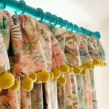 Floral patterned curtains with yellow tassels