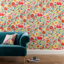 Bright floral wall covering with matching cushion